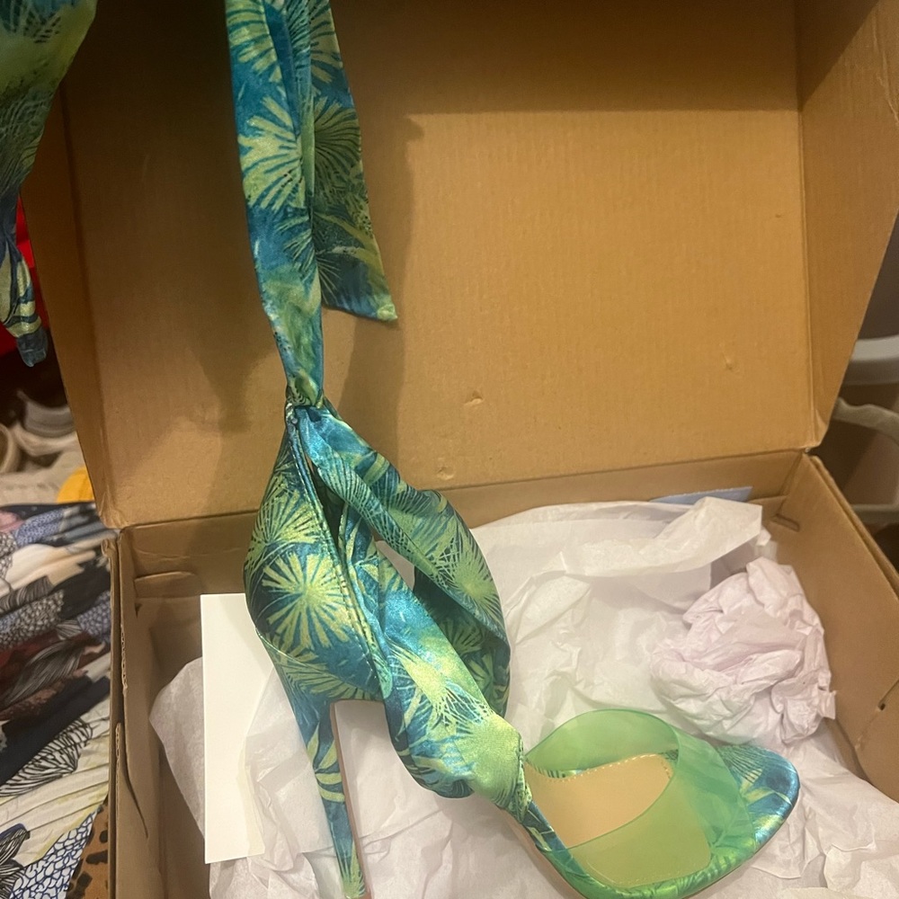 Brand new, never worn. Silk wrap heel.